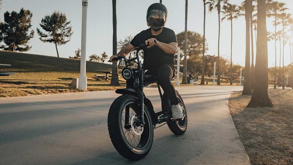 Rider on a paved path at golden hour
