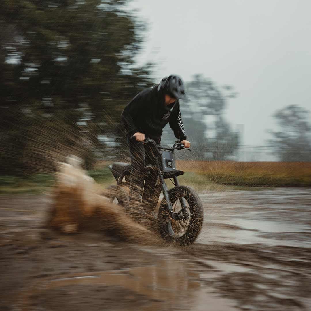 Rider on a paved road at sunset
